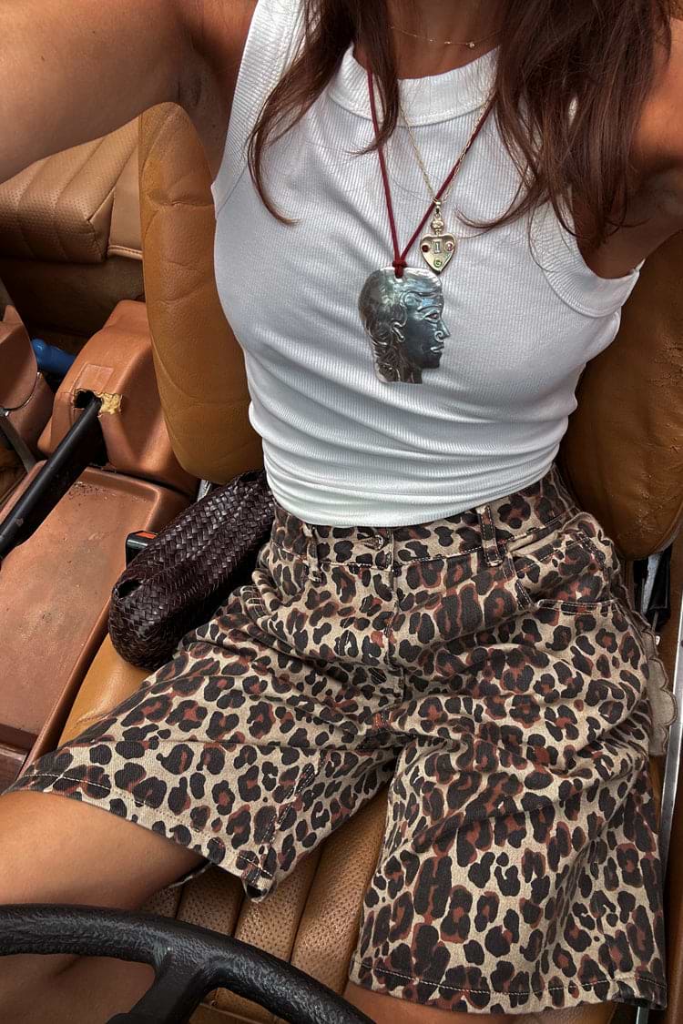 caption_Model wears Leopard Lucia Scallop Pocket Long Shorts in UK size 10/ US 6