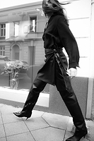 Thumbnail for caption_Model wears Black Vegan Leather Mini Jaspre Skirt in UK size 10/ US 6
