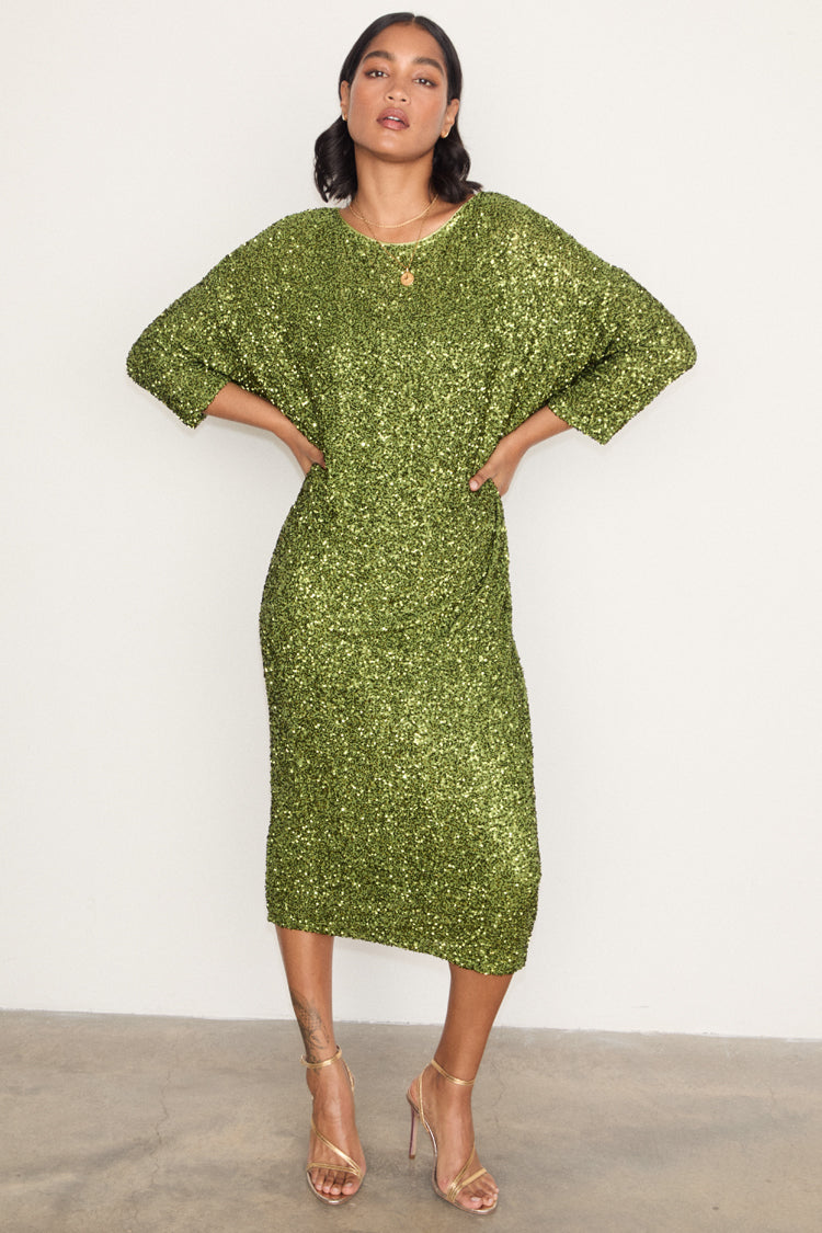 caption_Model wears Olive Sequin Jem Dress in UK size S/M