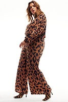 Thumbnail for Model wearing Animal Jumpsuit standing facing the camera side ways