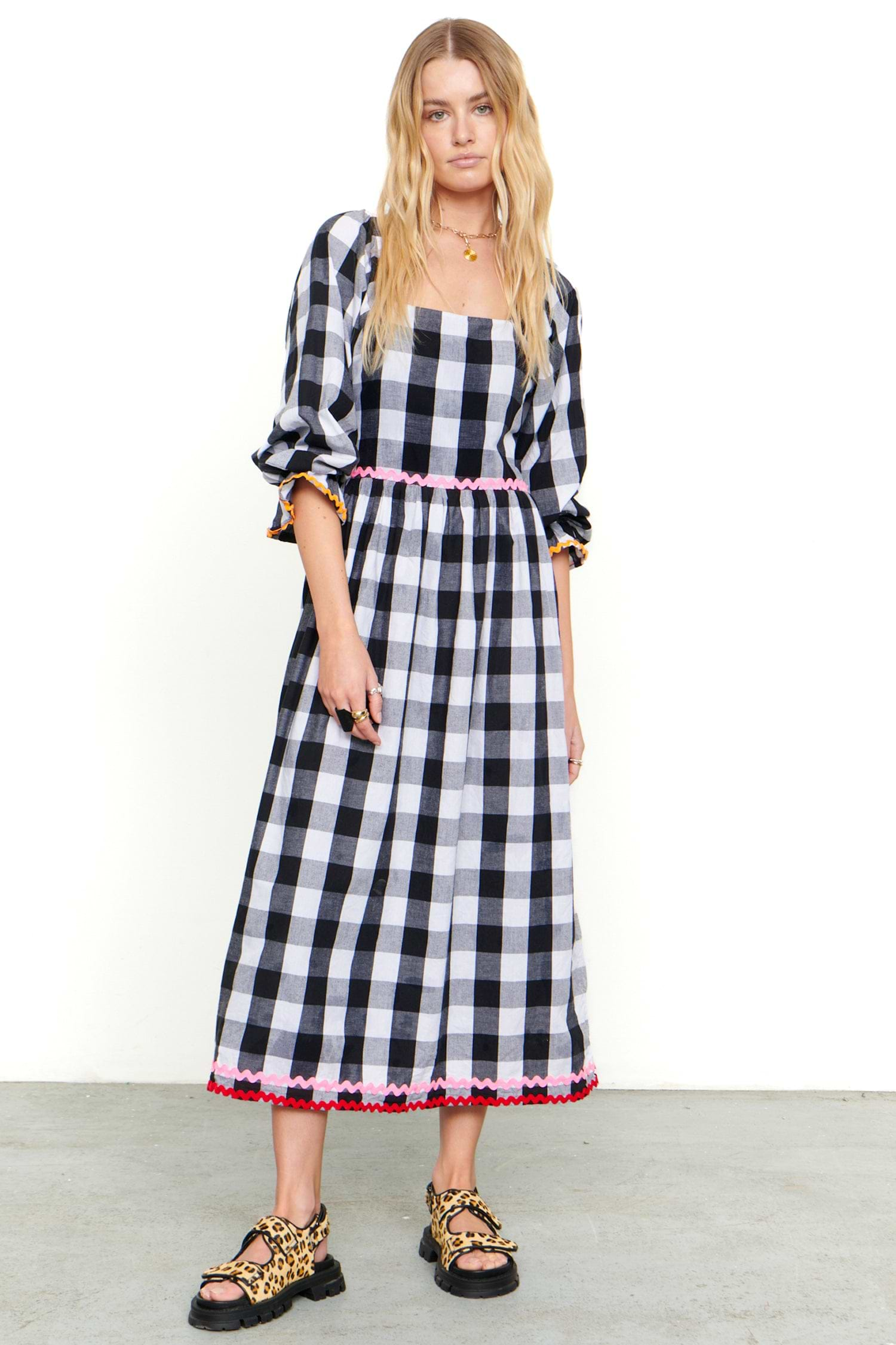 Model wearing Gingham Macy Midi Dress standing facing the camera 