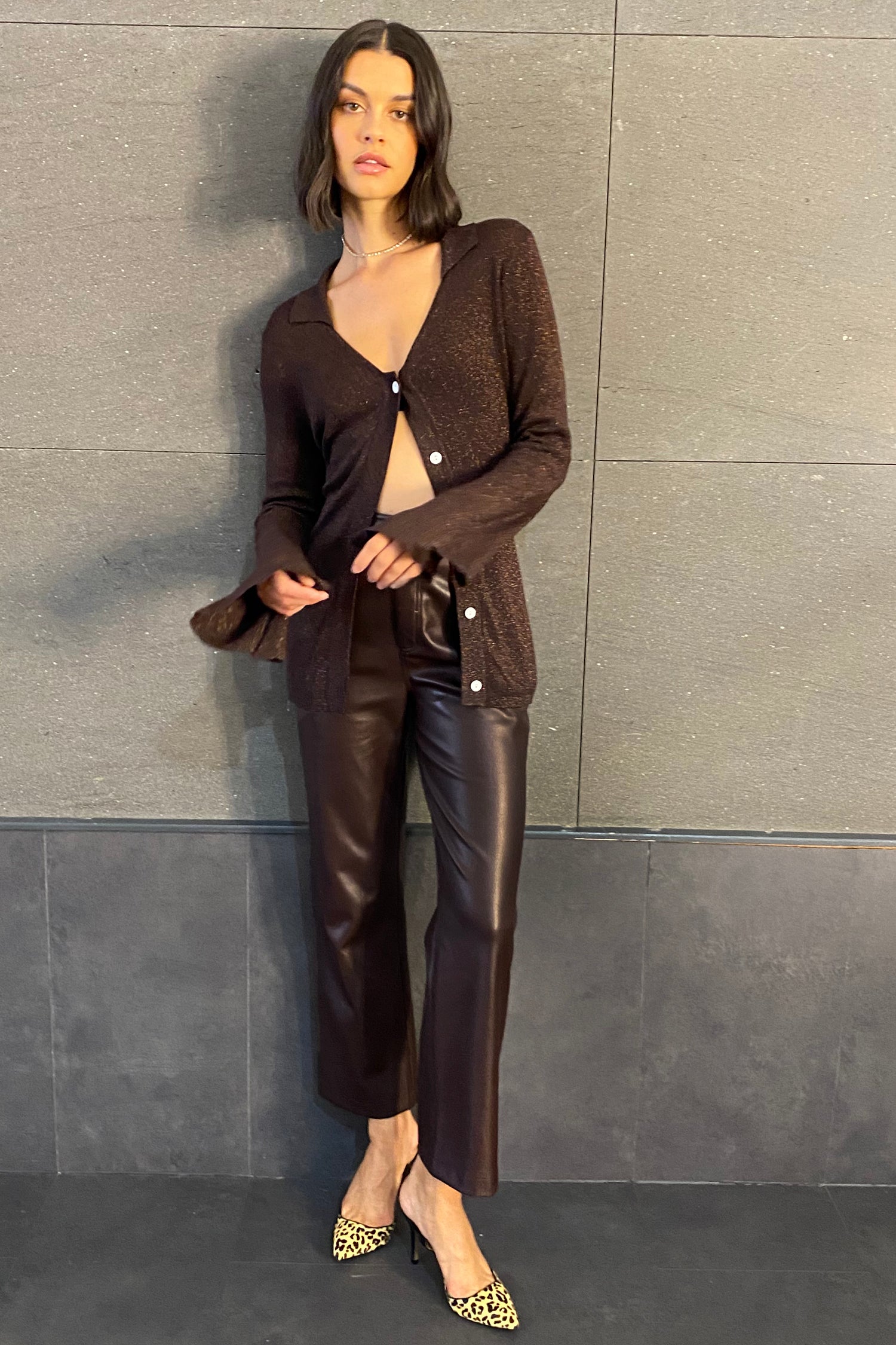Model Chocolate Vegan Leather Trouser standing facing the camera