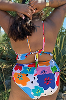Thumbnail for Model wearing Dotty Bikini Bottom standing facing away from the camera