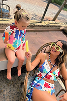 Thumbnail for Model wearing Dotty Bikini Top sitting down