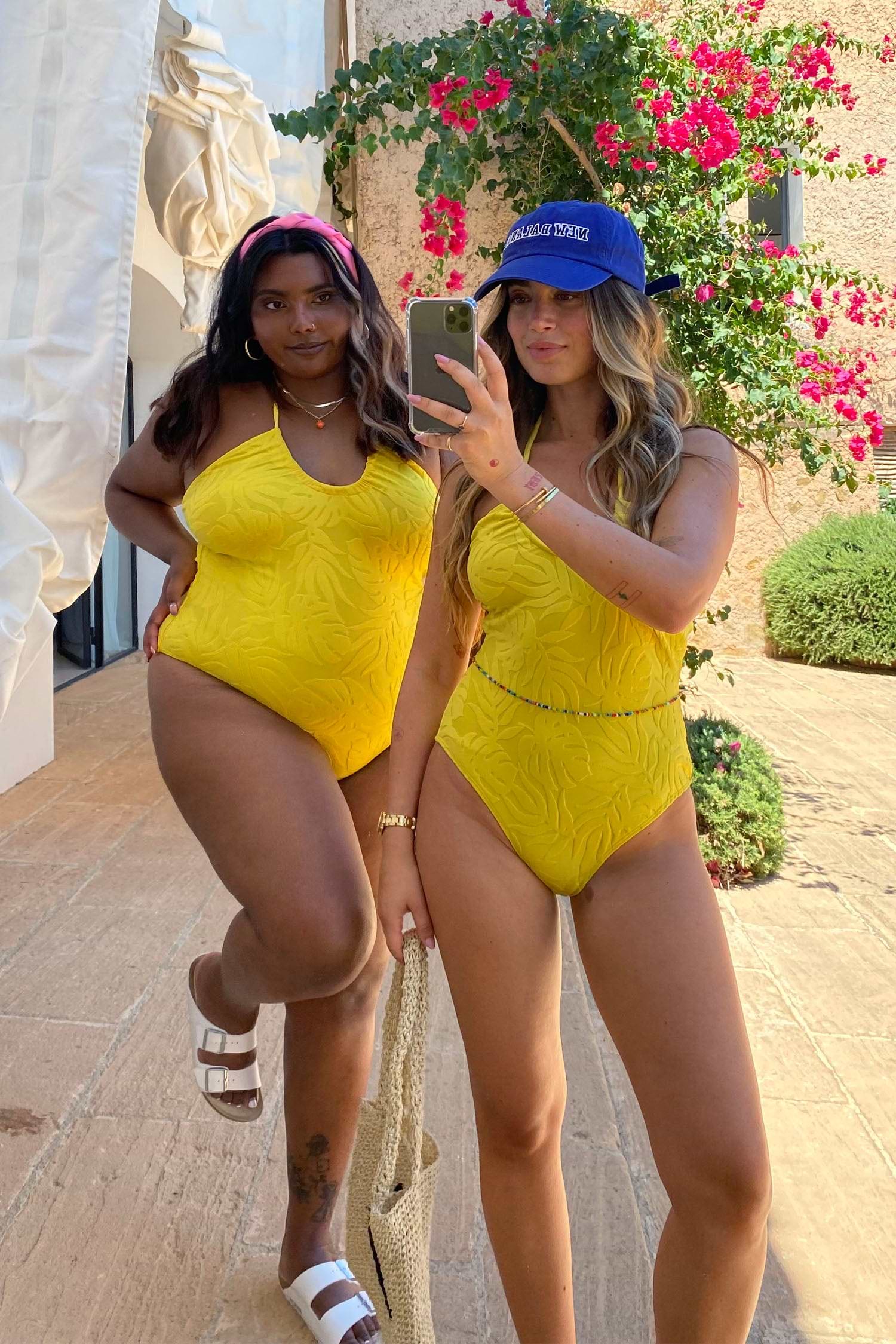 Model wearing Yellow Palm Swimsuit facing the camera