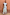 Thumbnail for Blue Stripe Alena Midi Dress featuring green and burgundy tiered stripes and ruffled sleeves on a model.