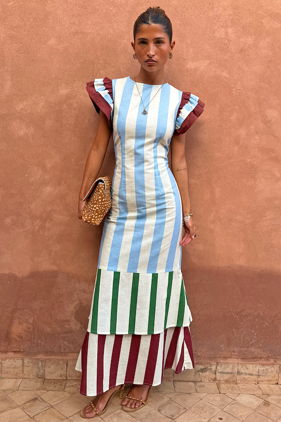 Blue Stripe Alena Midi Dress featuring green and burgundy tiered stripes and ruffled sleeves on a model.