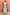 Thumbnail for Blue Stripe Alena Midi Dress featuring ruffled sleeves and a tiered striped hem, posed against a terracotta wall.