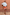 Thumbnail for Blue Stripe Batwing Blouse with high neck and wide sleeves, styled with red shorts against a terracotta wall.