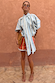 Blue Stripe Batwing Blouse with oversized sleeves and a bow neck, paired with striped shorts.
