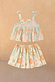 Girl's Starburst Skirt Co-ord Set in blue cotton featuring a peplum top and tiered skirt with sun and star motifs.