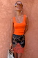Coral Scoop Neck Rib Tank in a soft ribbed fabric paired with a floral lace-trimmed skirt.
