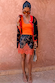 Coral Scoop Neck Rib Tank styled with a patterned lace trim mini skirt and cardigan