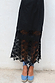 Model wearing Black Star Sasha Dress standing facing the camera