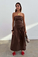 Model wearing Chocolate Lola Mid-axi Dress featuring a strapless ruched bodice and full brown cotton skirt.