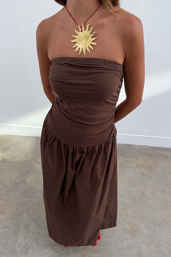 Chocolate Lola Mid-axi Dress in cotton with a ruched bodice and full skirt, styled strapless with a gold sun pendant.