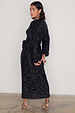 caption_Model wears Black Sequin Kira Wrap Dress in UK size 10/ US 6