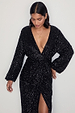 caption_Model wears Black Sequin Kira Wrap Dress in UK size 10/ US 6