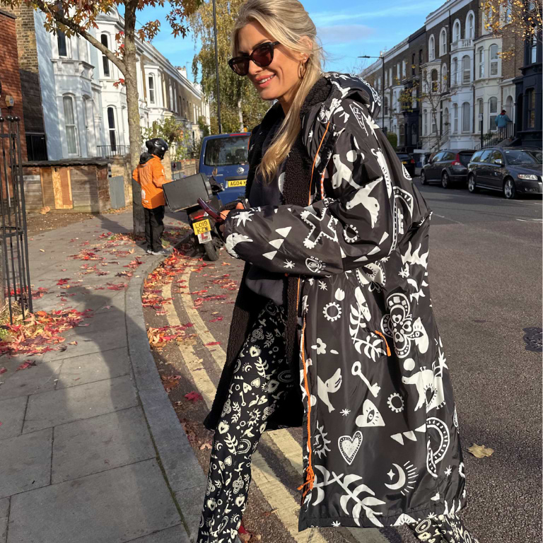 model is wearing our hope charcoal changing robe and flare leggings 