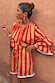 Tomato Stripe Ellie Shorts and matching blouse with red and camel stripes and light blue trim.