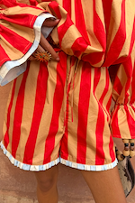 Red and camel striped Tomato Stripe Ellie Shorts with a drawstring waist and contrast frill hem.
