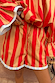 Red and camel striped Tomato Stripe Ellie Shorts with a drawstring waist and contrast frill hem.