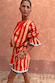 Tomato Stripe Ellie Shorts and matching blouse in red and camel with contrast trims
