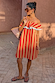 Tomato Stripe Mini Dress in red and camel with a ruffled neckline and off-the-shoulder styling.