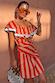 Model wearing the red and camel Tomato Stripe Mini Dress with ruffle detailing and sunglasses.
