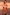 Thumbnail for Model wearing the red and beige striped Tomato Stripe Scarf with oversized sunglasses.