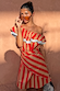 Tomato Stripe Scarf in red and cream, styled as a multi-wear ruffled dress on a model.