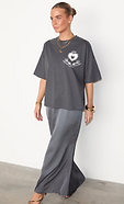 model is wearing the grey midnight romance t-shirt ontop of the grey satin reha dress 