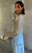 model wears our silver sequin tia top with our blue scallop jeans