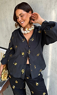 model is wearing our black gold snake shirt and trousers co-ord