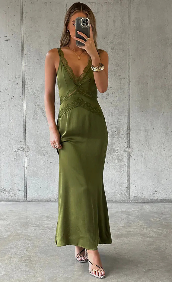 model is wearing the olive satin midi dress with lace inserts on the waist and neckline