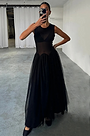 model is taking selfie wearing the black monika dress