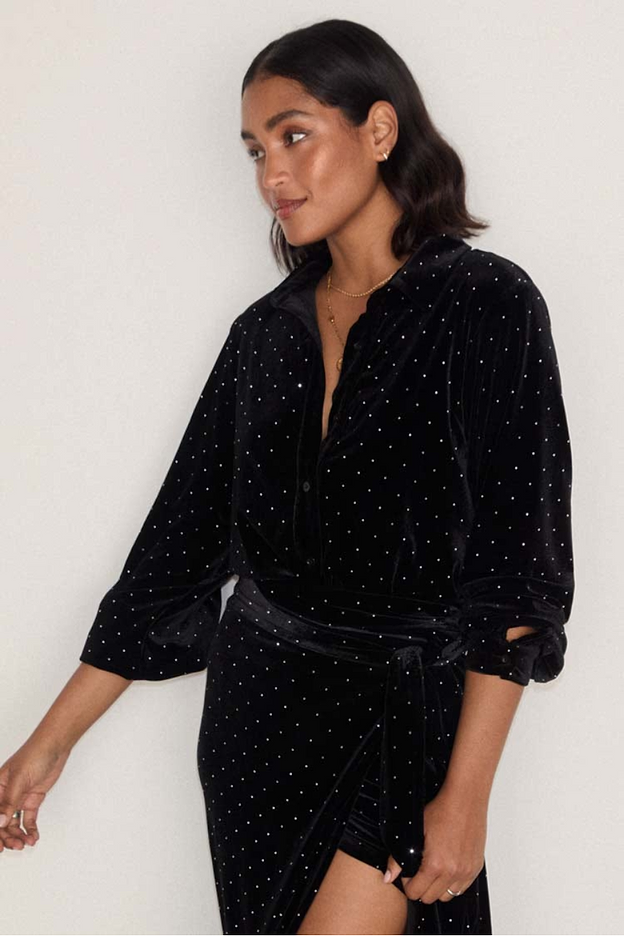 model is wearing the black velvet cristi shirt with silver studs with the matching jaspre skirt