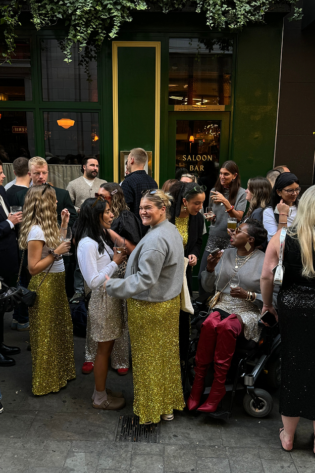 customers and staff outside the devonshire for our sequin march event 