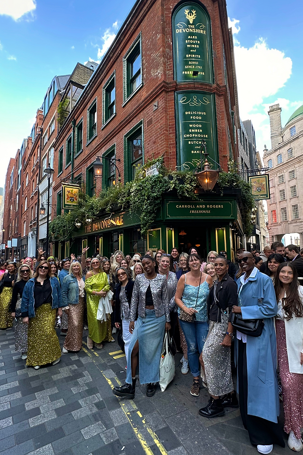 customers and staff outside the devonshire for our sequin march event 