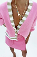 close up image of the sadie cardigan and pink mini jaspre 