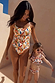 Girl's multicoloured Banana Bikini with a ruffled top and matching bottoms for a sunny vacation.