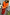 Thumbnail for Gonna Red Celestial Dorris con stampa mistica, abbinata a un top arancione e cintura con pietre verdi.