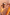Thumbnail for Girl's Yellow Sun Swimsuit with sun print and frill detailing, worn with a straw hat against a peach wall.