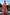 Thumbnail for Girl wearing a pink fruit print wide leg set and peplum top, standing outdoors for a coordinated vacation look.