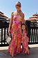 Girl wearing a pink fruit print wide leg set and peplum top, standing outdoors for a coordinated vacation look.
