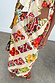Gonna Mabel midi con stampa fruit stamps colorata e coulisse, indossata in un set coordinato.