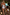 Thumbnail for Girl's blue Starburst Crop Bikini Set with frill trims, walking towards a swimming pool on vacation.