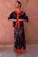 Tan Jaden Floral Jacquard Cardigan with red trim styled with matching floral lace hem skirt