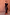 Thumbnail for Maeva Skirt in Tan Jaden Floral Print with orange lace trim, worn by a model against a clay wall.