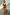 Thumbnail for Rio A-Symmetric Skirt in a multi-coloured tropical fruit print worn by a model with a matching co-ord top.